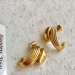 gold-steel-ribbed-dome-half-hoop-earrings