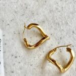 gold-steel-wavy-hoop-earrings